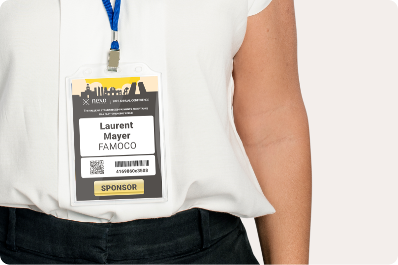 A person wearing badge designed for bauma 2022 exhibition.
